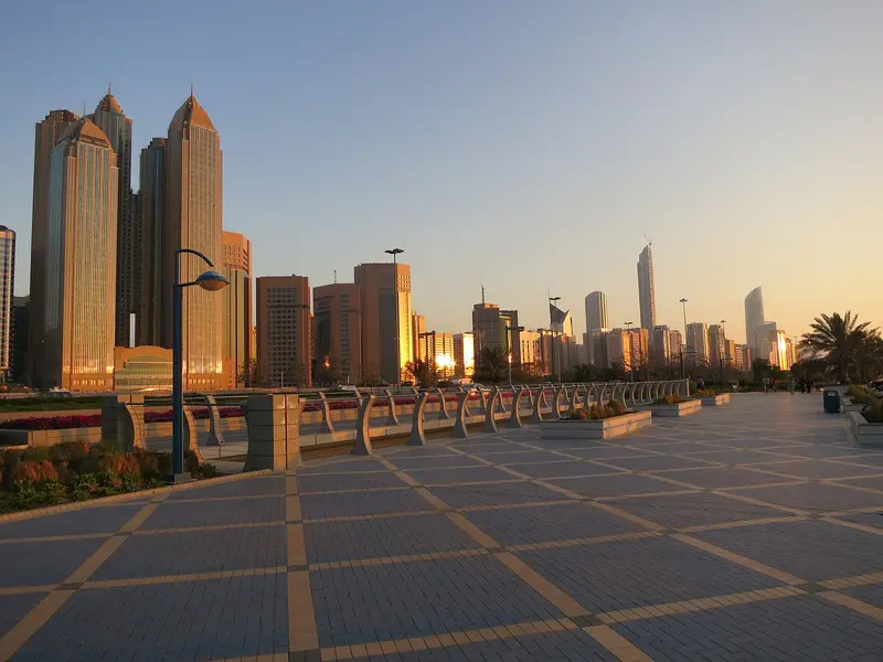 The Abu Dhabi skyline at sunset from the Corniche promenade